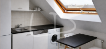 Modern attic kitchenette with skylight.png